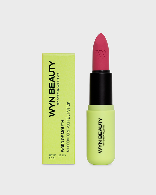 Bright pink lipstick beside a neon green box labeled "WYN BEAUTY" by Serena Williams.