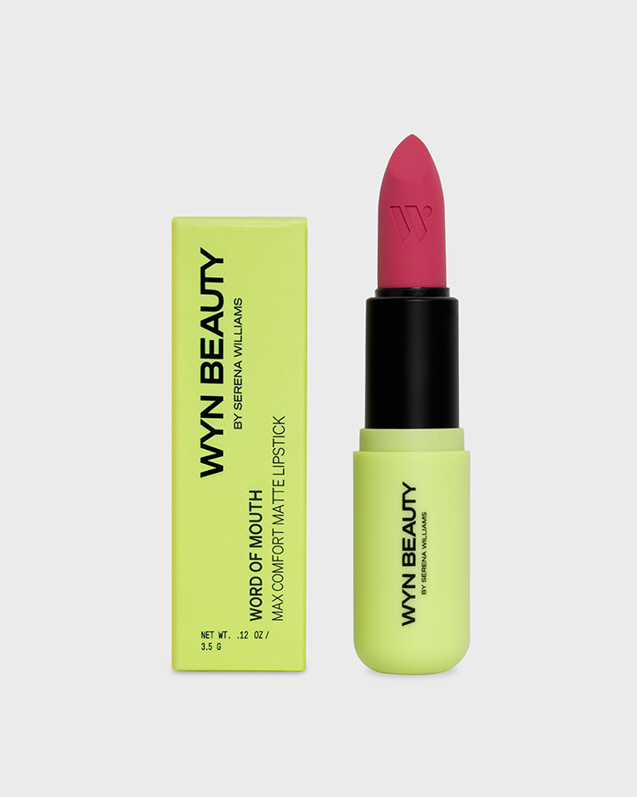 Bright pink lipstick beside a neon green box labeled "WYN BEAUTY" by Serena Williams.